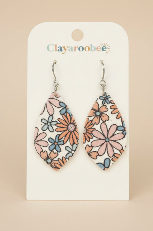 Teardrop-shaped dangle earrings with a pink, orange, and blue floral pattern on a white background, displayed on a white Clayaroobee card.